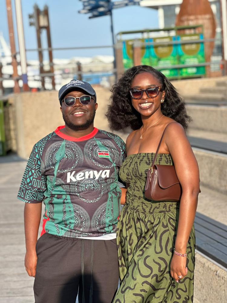 Ian in a Kenya jersey beside Tete in a green dress